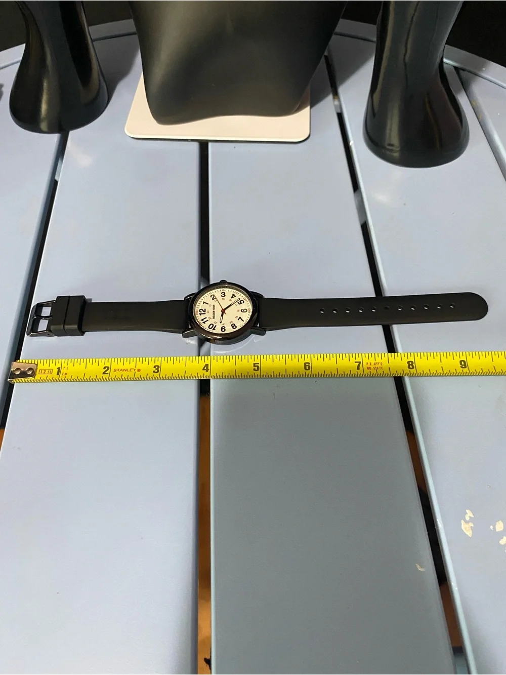 Golden hour Black analog wristwatch with white face and black hands